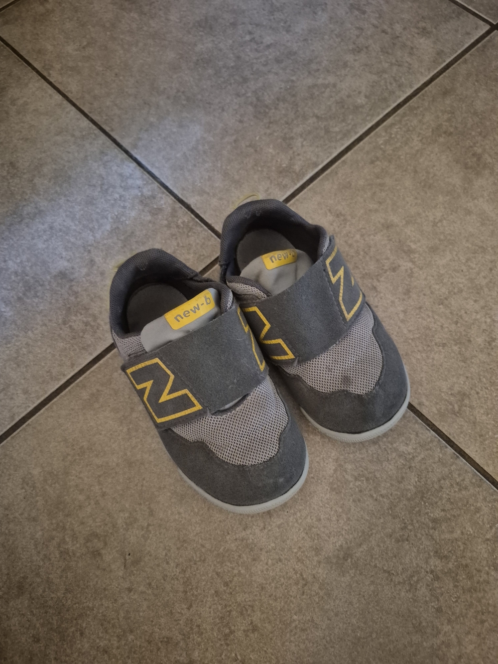 New Balance Kids Gray Sneakers with Yellow Accents